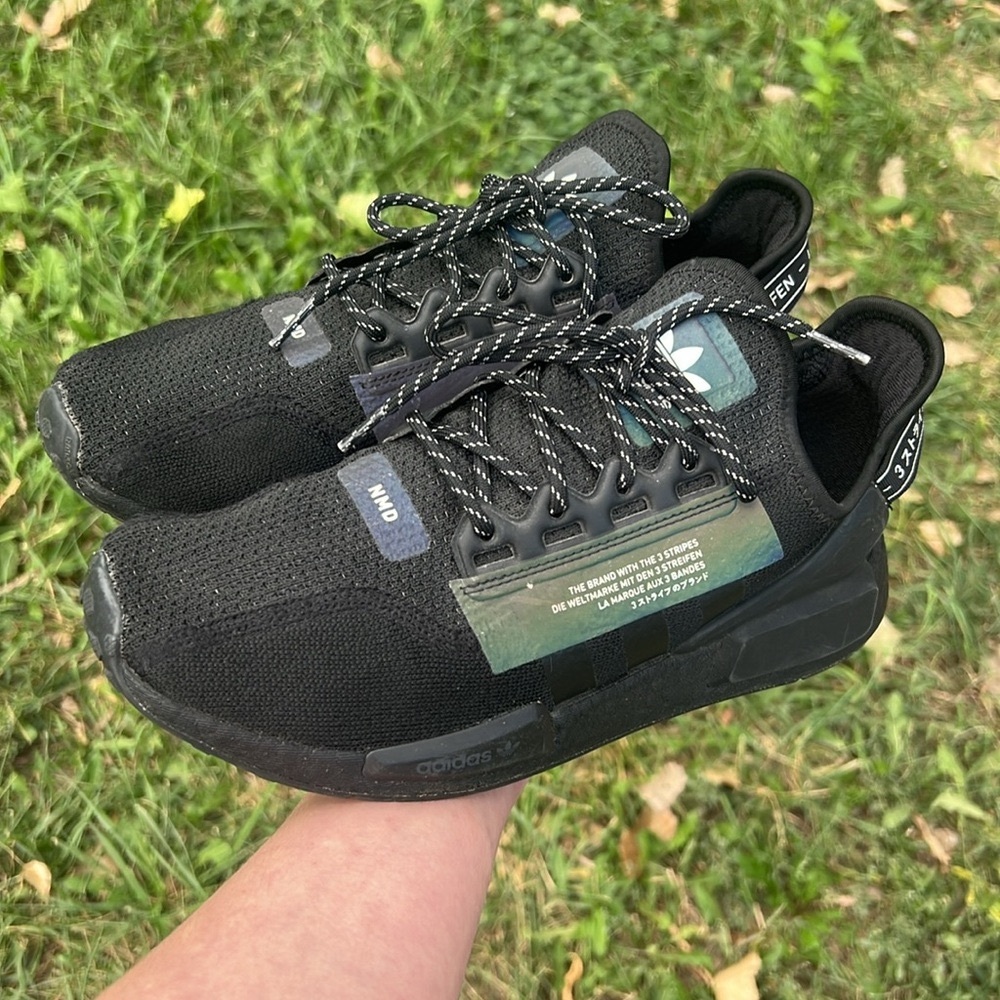 Adidas NMD black runners reflective stripe